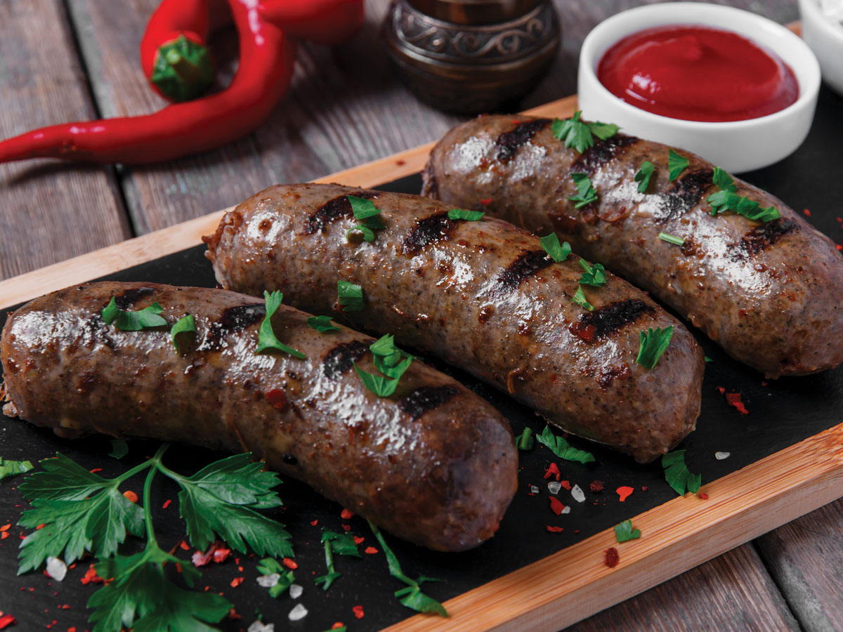 Cooked sausage with tomato ketchup image