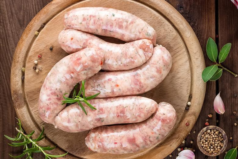 A home economist prepares sausage products for tasting as part of the UKSW judging process.