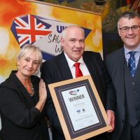 Best Butcher Scotland Traditional Sausage: L-R: Host Lesley Waters with winner Alastair Paul of A&I Quality Butchers with category partner Gordon King of Scottish Craft Butchers