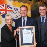 Best Butcher Scotland Innovative Sausage: L-R: Host Lesley Waters with winner Robert McFarlane of Donald Russell with category partner Gordon King of Scottish Craft Butchers