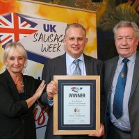 Best Butcher Wales Traditional Sausage: L-R: Host Lesley Waters with winner Martin Player of Martin Player High Class Butcher with category partner Keith Fisher of The Institute of Meat