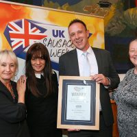 Best Foodservice Innovative Sausage: L-R: Host Lesley Waters with winners Helen Squires and John Pilcher of Solent Butchers with category partner Judith Johnson of Kerry