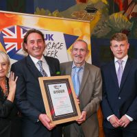 Best Manufacturer/Own Brand Innovative Sausage: Host Lesley Waters with winners James Mackellar and Lee Wright of Orchard View Farm with category partner Harry Bosse of Bosse Interspice